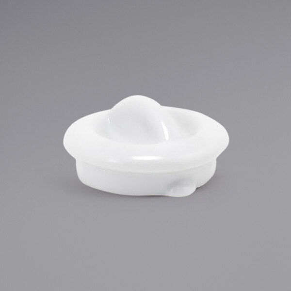 A white plastic round lid with a spiral top.