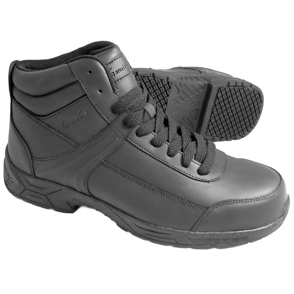 A pair of Genuine Grip black steel toe boots.
