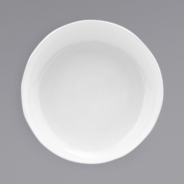 A Front of the House Kiln superwhite porcelain plate with a white rim.
