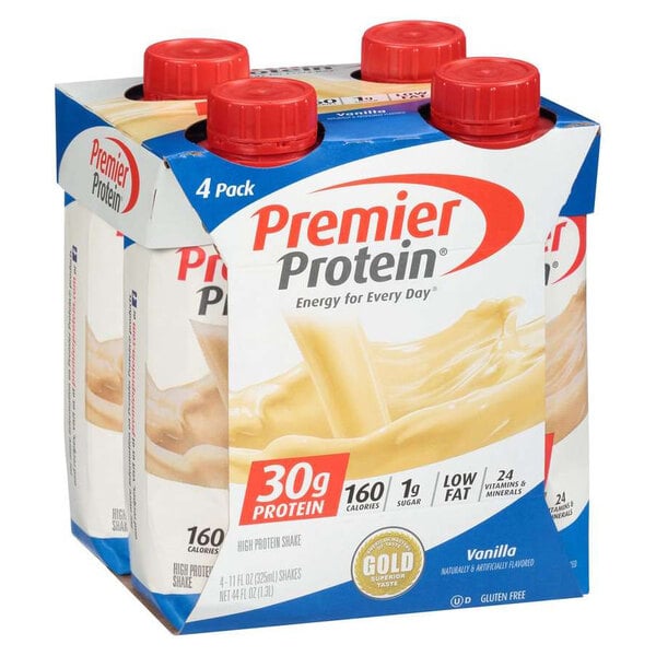 A group of Premier Protein Vanilla Protein Shake cartons with red bottle caps.