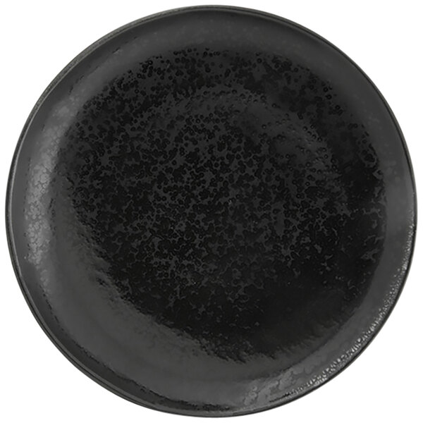 A black porcelain plate with a black pepper speckled rim.