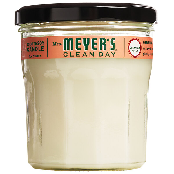 A case of 6 Mrs. Meyer's Clean Day Geranium scented wax candles in a white jar with a black lid.