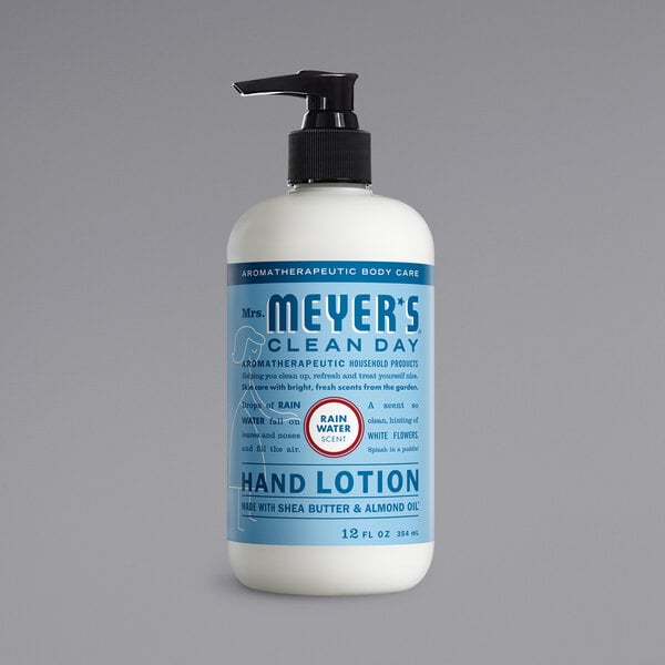A white Mrs. Meyer's Clean Day hand lotion bottle with a blue label on a counter.