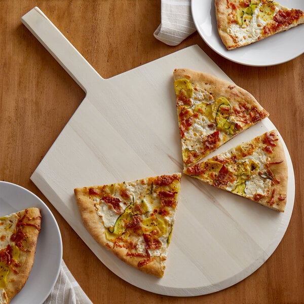 A slice of pizza on an American Metalcraft wood pizza peel.