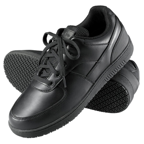 A pair of black Genuine Grip Women's Sport Classic non slip shoes with laces.