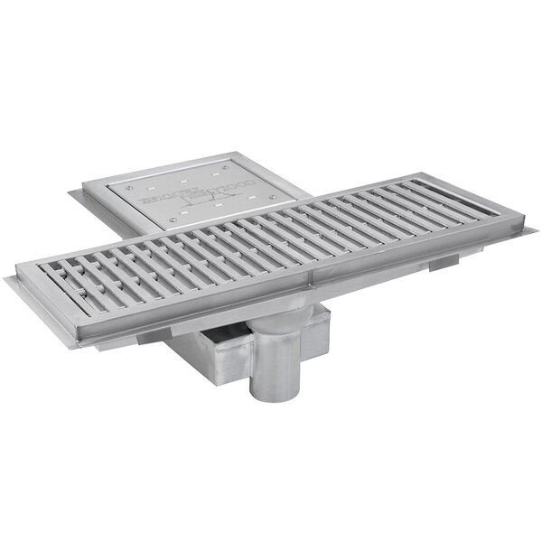 An Eagle Group metal floor trough with a metal grate cover.