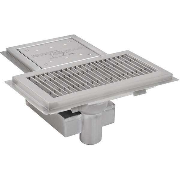 A stainless steel Eagle Group floor trough with grating over the top.