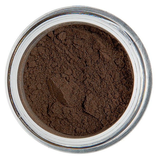 A jar of brown powder with a Forest Green label.