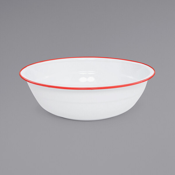 A white basin with red rolled rim.