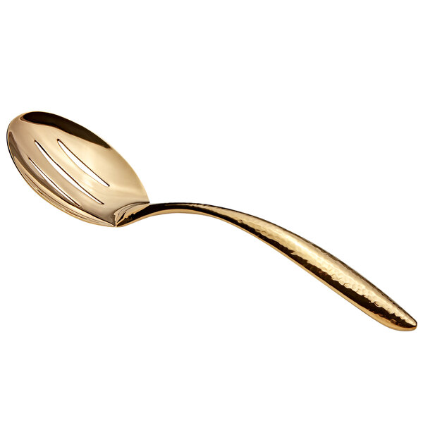 A gold stainless steel slotted serving spoon with a hammered hollow handle.