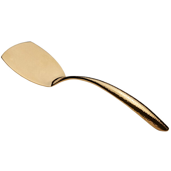 A gold stainless steel serving turner with a hollow handle.
