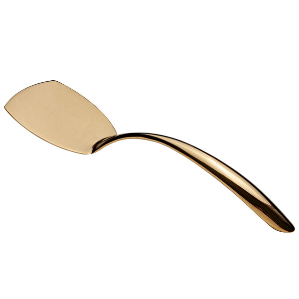 A gold stainless steel turner with a hollow handle.