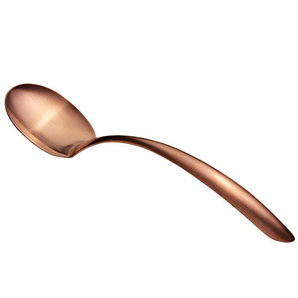 A close-up of a Bon Chef rose gold matte stainless steel serving spoon with a hollow handle.