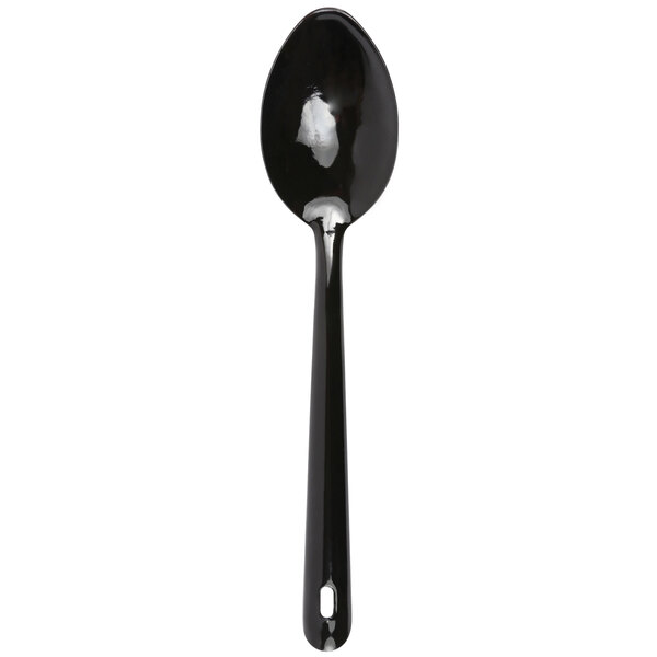 A black Crow Canyon Home enamelware serving spoon with a white handle.