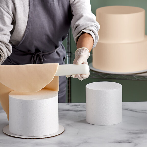 A close-up of a Baker's Mark round cake dummy kit.