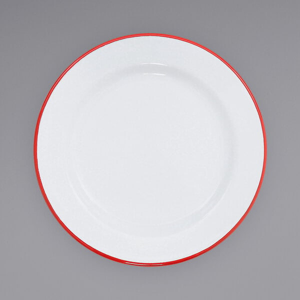A white Crow Canyon Home enamelware plate with a wide red rim.