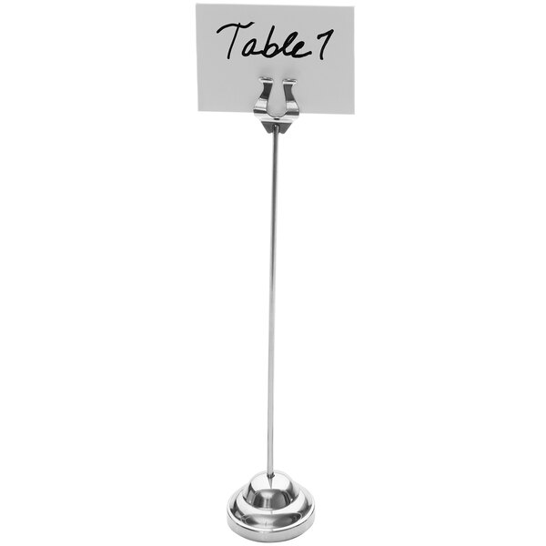 An American Metalcraft stainless steel table card holder with a white card on a table.