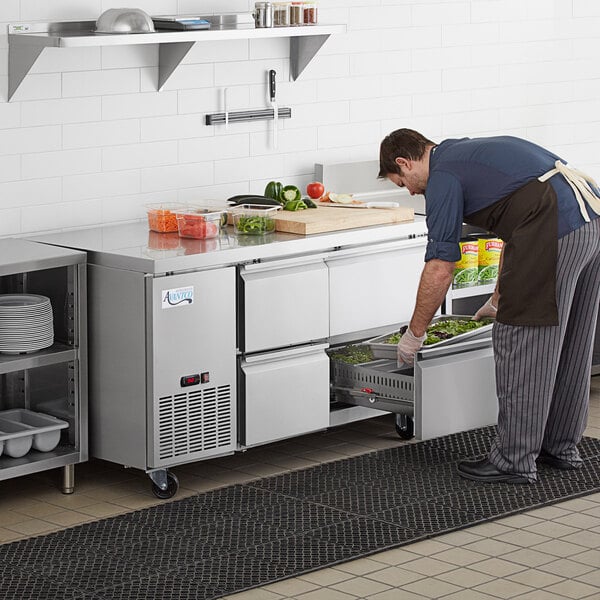 a person putting food into a drawer