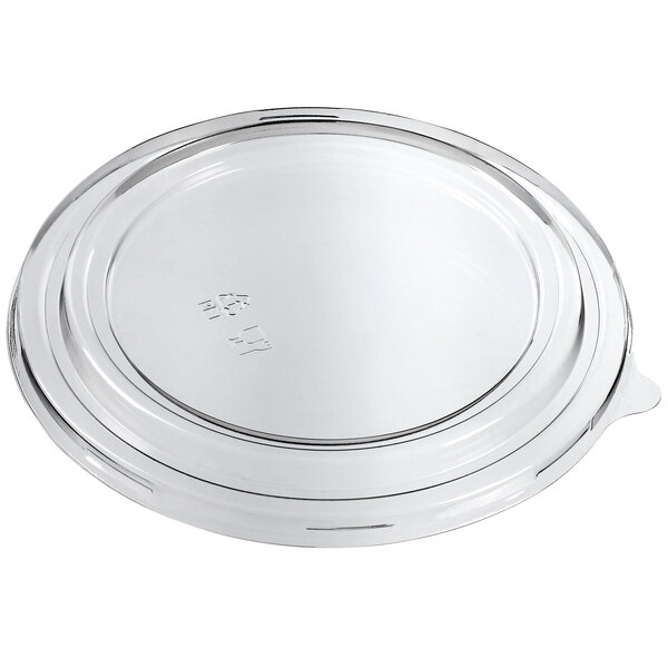 A clear plastic lid on a clear plastic container with a round rim.