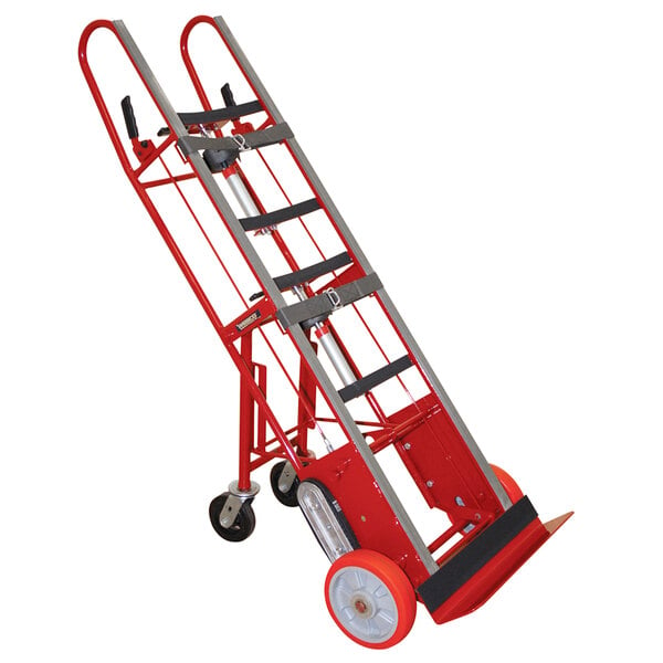 A red and silver metal Wesco hand truck with swivel casters.