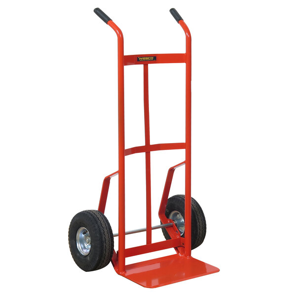 A red Wesco Industrial hand truck with black pneumatic wheels.