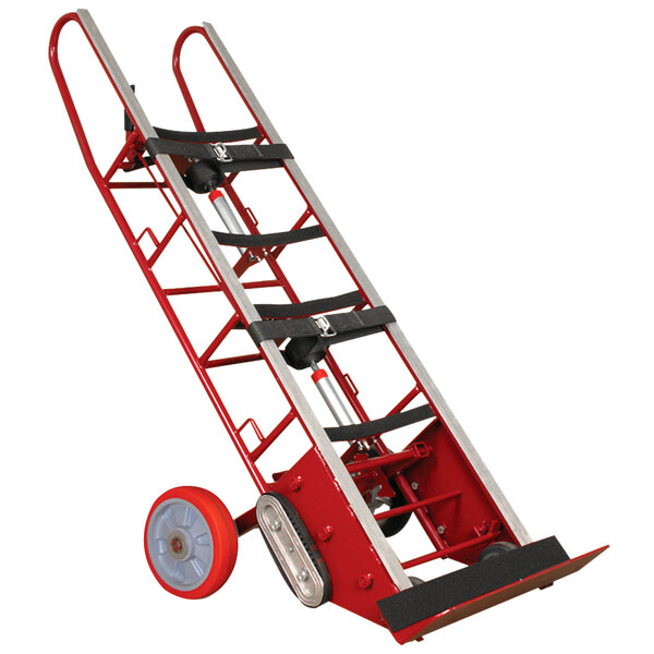 A red and silver Wesco Industrial Products heavy-duty appliance hand truck with wheels and a handle.