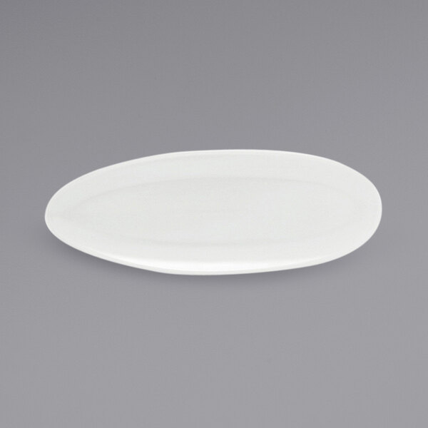 A Front of the House Tides white oval porcelain plate on a gray background.