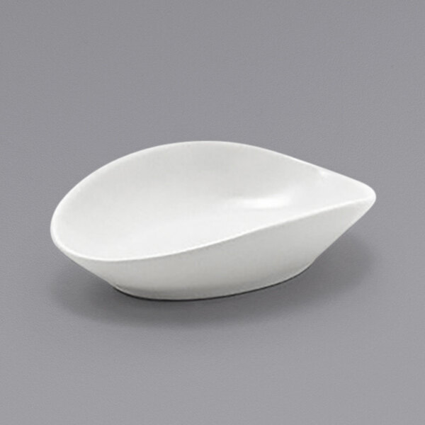 A Front of the House Tides white porcelain oval ramekin.