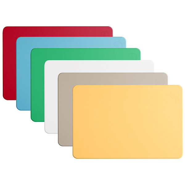 A group of colorful rectangular cutting boards with yellow and gray borders.