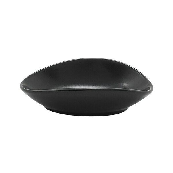 A black oval Front of the House Tides ramekin with curved edges on a white background.