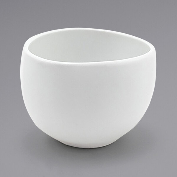 A Front of the House Tides white porcelain bowl on a gray background.