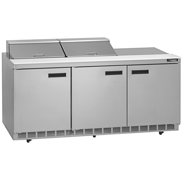 A stainless steel Delfield sandwich prep table with three doors.