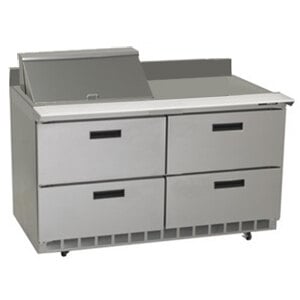 A stainless steel Delfield sandwich prep table with drawers.