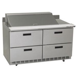 A Delfield stainless steel refrigerator with four drawers.