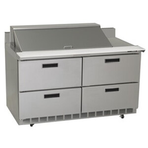 A Delfield stainless steel sandwich prep table with drawers.