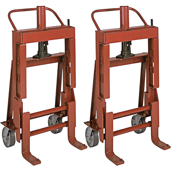 A red metal Wesco Machinery Mover with 6 wheels.