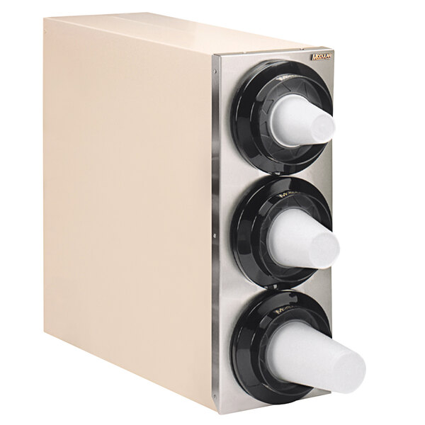 A white Modular Simpli-Flex countertop cup dispenser cabinet with black knobs.
