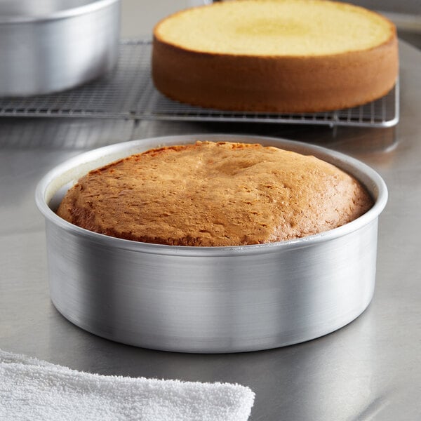 A cake in a Baker's Mark aluminum pan with a removable bottom.