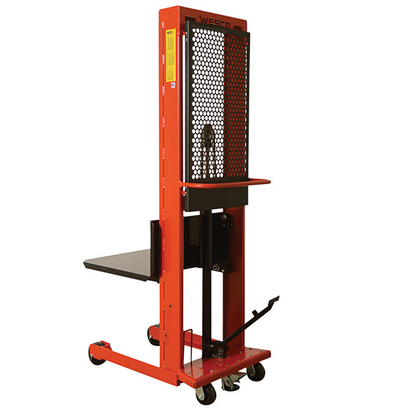 A red and black Wesco hydraulic platform stacker with a metal platform.