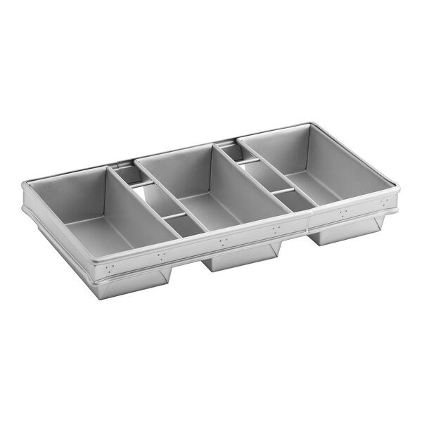 A three-compartment glazed aluminized steel bread loaf pan for baking multiple loaves at once.