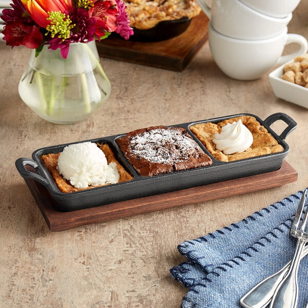 A Valor mini cast iron server tray with three desserts on it.