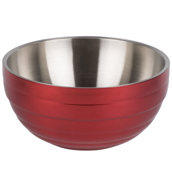 A red and silver stainless steel Vollrath beehive serving bowl with a handle.