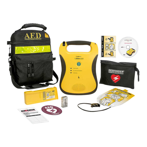 A black and yellow Defibtech Lifeline AED kit bag with accessories inside.