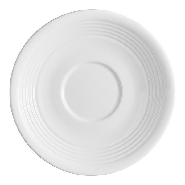 A white stoneware saucer with a circular indentation in the center and subtle concentric ridges along the rim.