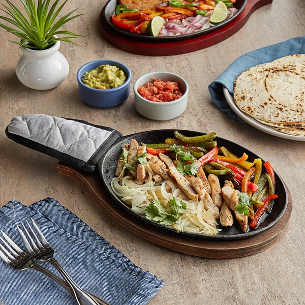 Choice 9 1/4 x 7 Oval Pre-Seasoned Cast Iron Fajita Skillet with Handle