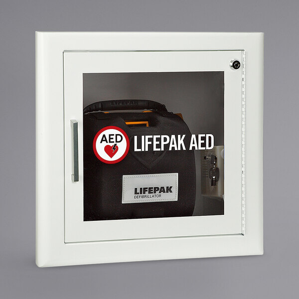 A white recessed mount AED cabinet with a black and white label.