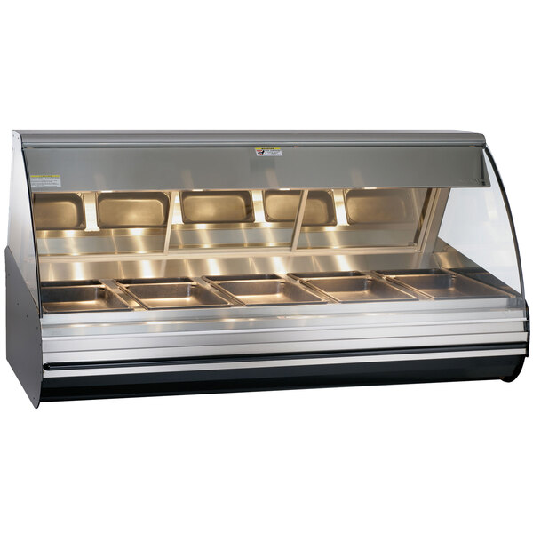 A black Alto-Shaam countertop heated display case with curved glass over food.