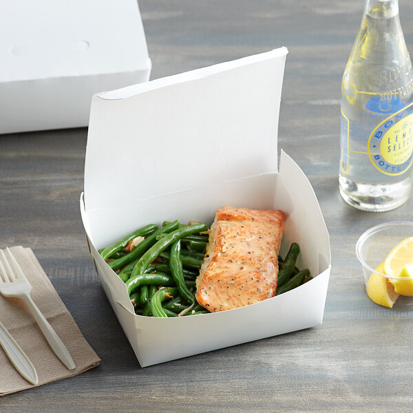 A white Fold-Pak take-out box filled with salmon and green beans.