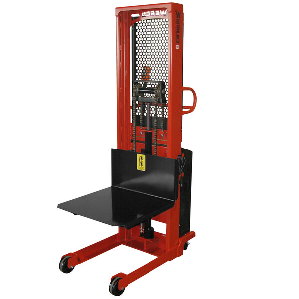 A red and black Wesco Industrial Products hydraulic lift platform stacker.