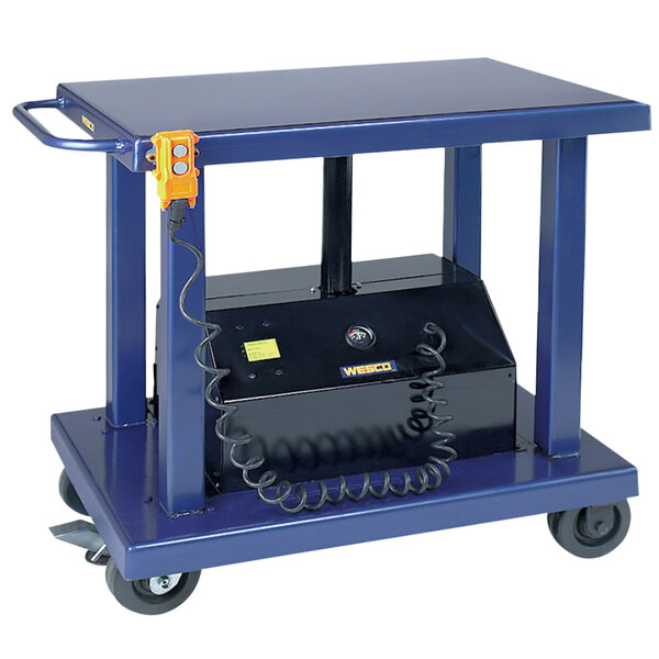 A blue Wesco Industrial Products battery-powered lift table with a black box on it.